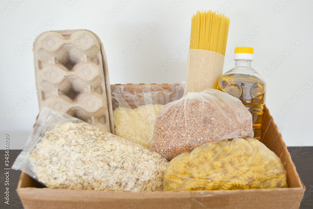 Food delivery, donation box, food box. Long-term storage products. Food supplies for the period of quarantine isolation. Food delivery, donation box, food box. Long-term storage products. Food supplies for the period of quarantine isolation.