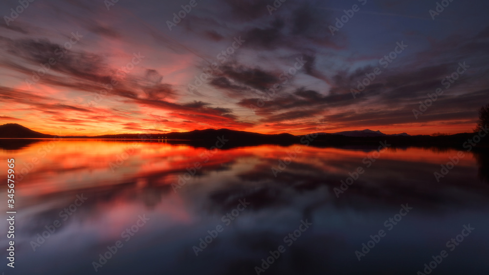 Amazing sky reflected in a lake in Vitoria, Spain