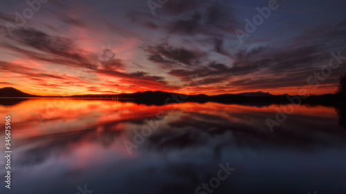 Amazing sky reflected in a lake in Vitoria, Spain