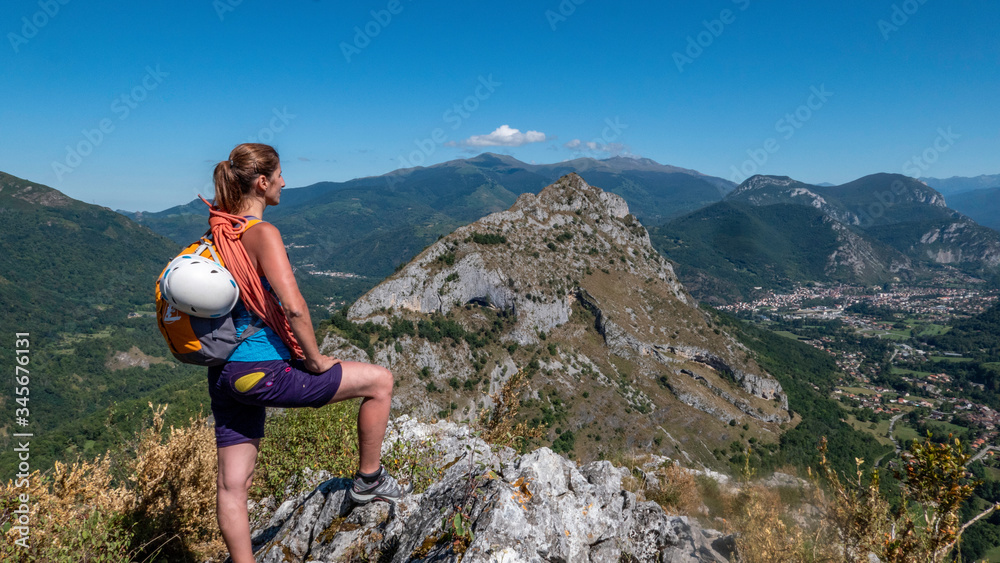 young woman hiking in mountains