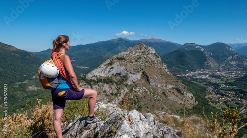 young woman hiking in mountains