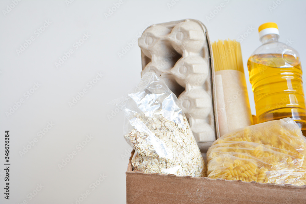 Food delivery, donation box, food box. Long-term storage products. Food supplies for the period of quarantine isolation. Food delivery, donation box, food box. Long-term storage products. Food supplies for the period of quarantine isolation.