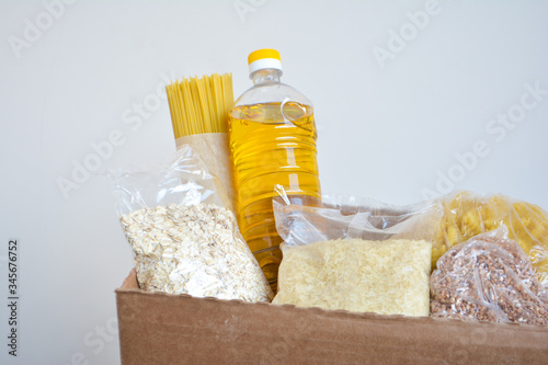 Food delivery, donation box, food box. Long-term storage products. Food supplies for the period of quarantine isolation.
