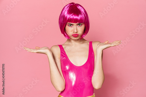 Image of party girl wearing wig holding copyspace and looking at camera