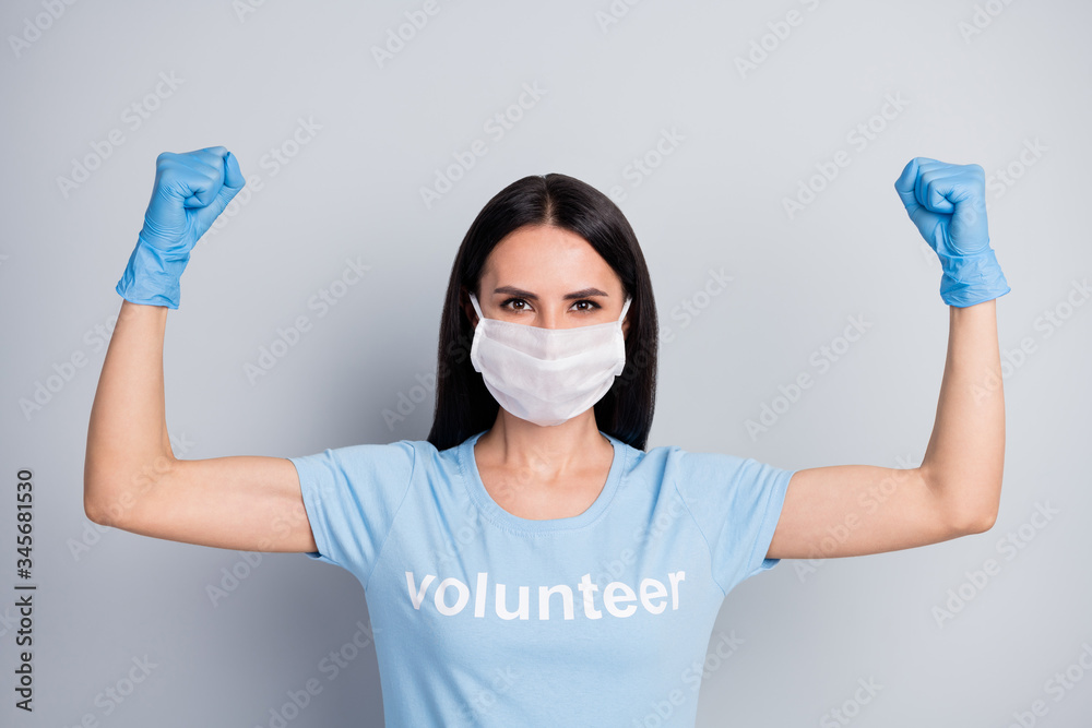 Close-up portrait of her she nice attractive lovely strong powerful girl medic doc voluntary work worker job demonstrating muscles save planet globe isolated over grey pastel color background Close-up portrait of her she nice attractive lovely strong powerful girl medic doc voluntary work worker job demonstrating muscles save planet globe isolated over grey pastel color background