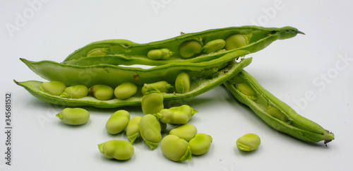 Wallpaper Mural panoramic of open green broad beans in their shells and some shelled beans isolated on a white background Torontodigital.ca