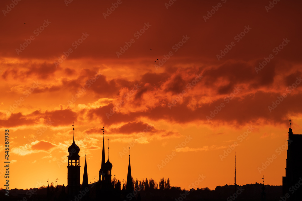 Astonishing red and orange sunset over Gdansk, Poland with silhouette of the cathedral