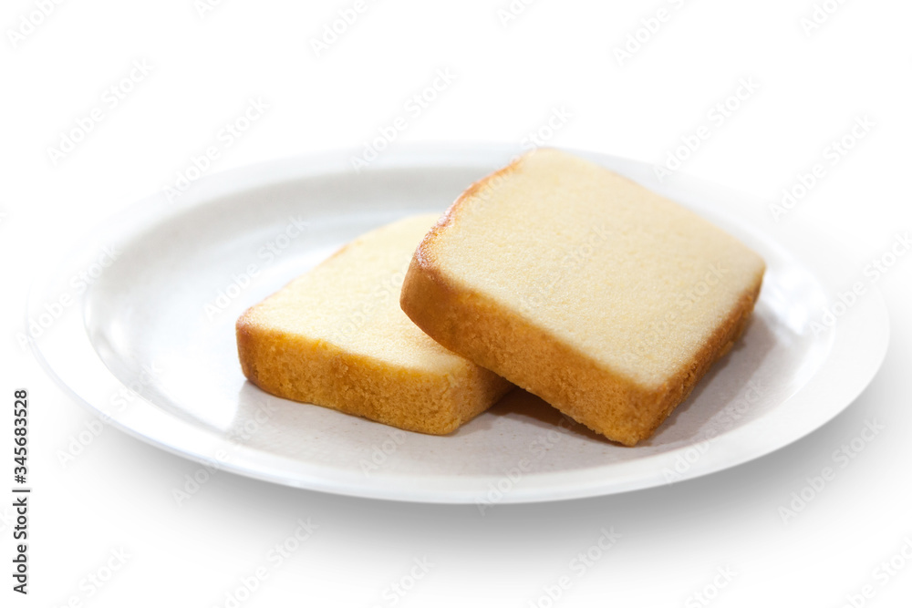 Butter cake sliced on plate isolated on white background. Butter cake sliced on plate isolated on white background.