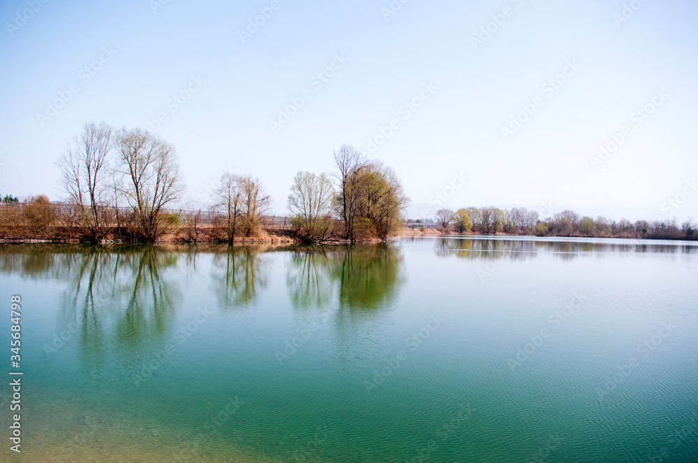 Green lake in spring time. clear sky,copy space. Nature backdrop.