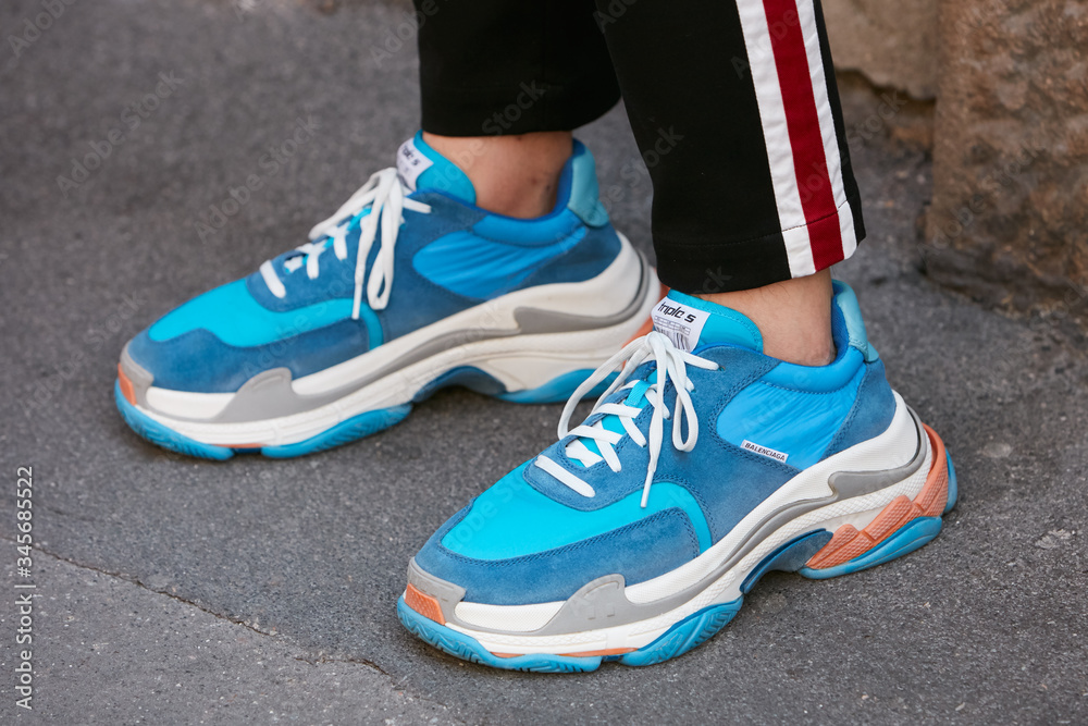Man with blue and white Balenciaga sneakers on June 17, 2018 in Milan, Italy foto de Stock Adobe Stock