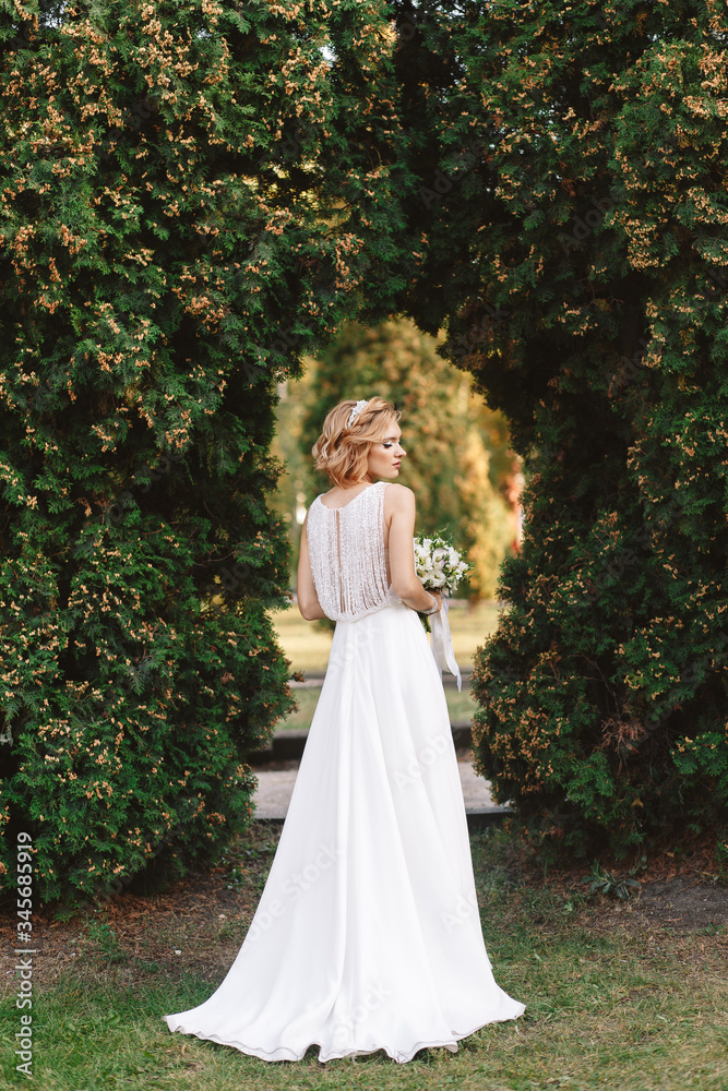 Portrait of the bride. Young girl, blonde in nature.