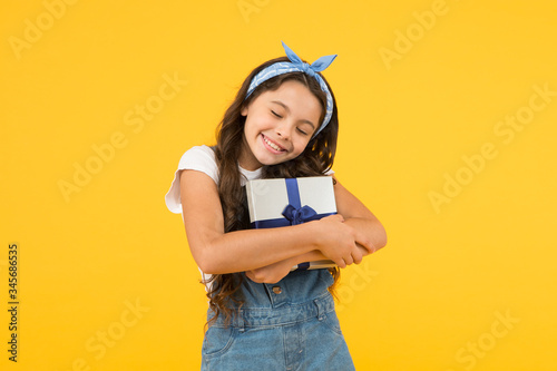 best resent ever. gift she expected. small girl customer open gift. happy holiday celebration. birthday party surprise. shopping online delivery. cheerful kid open wrapped box. Best quality photo