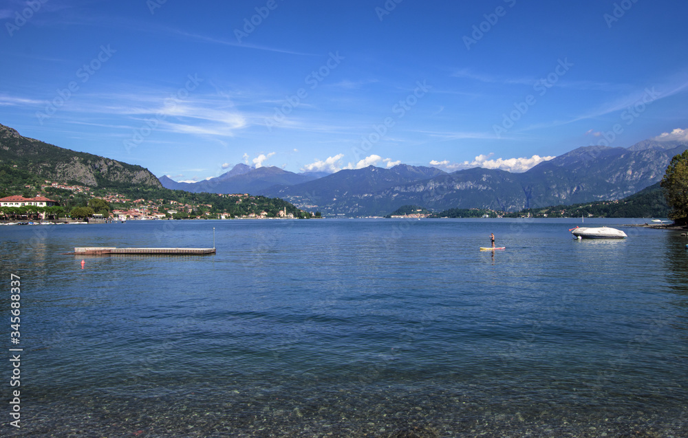 panorama of Como lake surrounded by mountains on a clear day