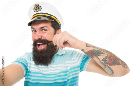 Funny sailor with cap and shirt. navy day. tourist on summer vacation. bearded man in captain cap has moustache. brutal man in sailor hat. summer marine male fashion. concept of tourism © be free