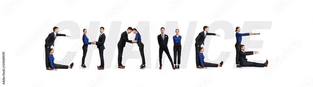 Group of people forming chance word at studio