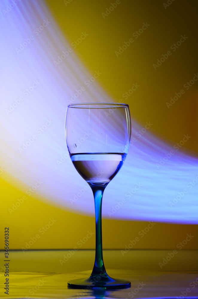 glass of wine with blue neon lights