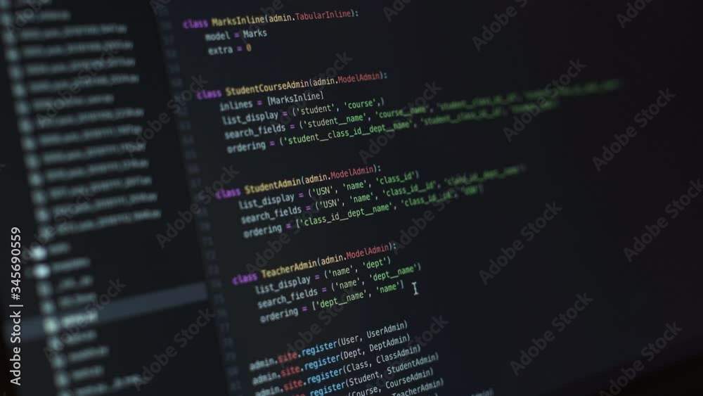 Close-up shot of a display with a programming code being written during pandemic covid-19 coronavirus. People have to work and study from home