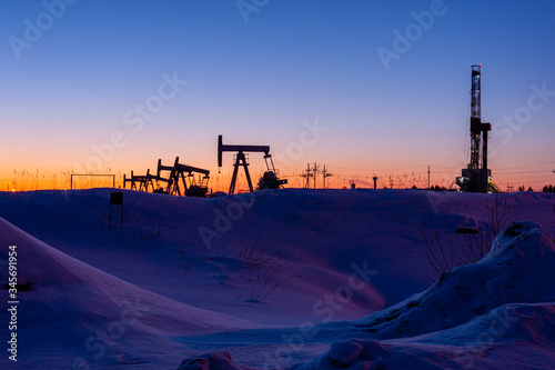 Oil and Gas Drilling Rig. Oil drilling rig operation on the platform in oil and gas industry. Global coronavirus COVID 19 crisis. Petroleum concept. War on oil prices. Environmental pollution.