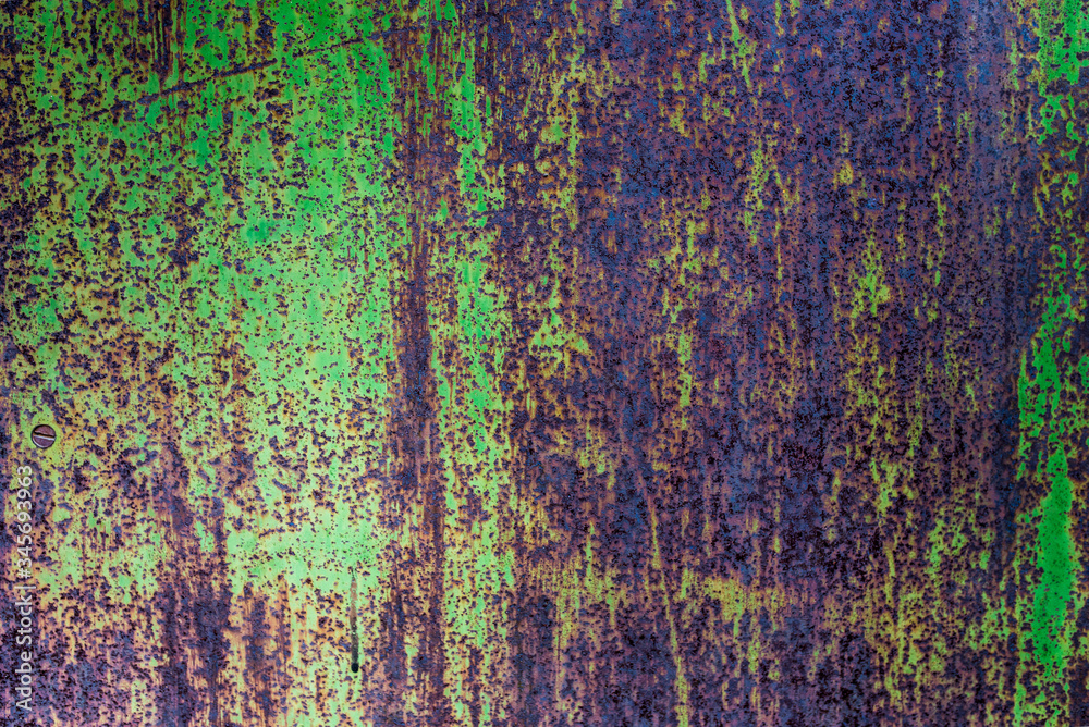 Texture of a rusty metal surface with white, green, salt, evergreen, dark blue, blue, aged cracked paint. Rusty and scratched painted metal wall