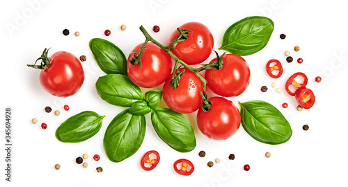 Tomato, basil, spices, pepper, garlic. Vegan diet food, creative cherry tomato composition isolated on white. Fresh basil, herb, tomatoes, cooking concept, top view.