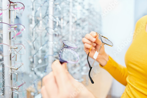 Eyeglasses collection in different shapes and sizes, finding the right frame. Focus on glasses frame
