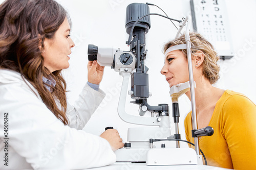 Ophthalmologist giving Slit lamp examination of the eyes in ophthalmology clinic