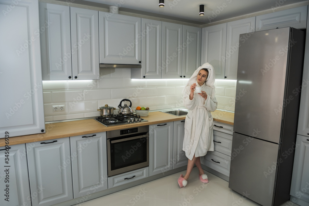 Gorgeous woman relax morning in kitchen and drinking enjoy coffee Gorgeous woman relax morning in kitchen and drinking enjoy coffee