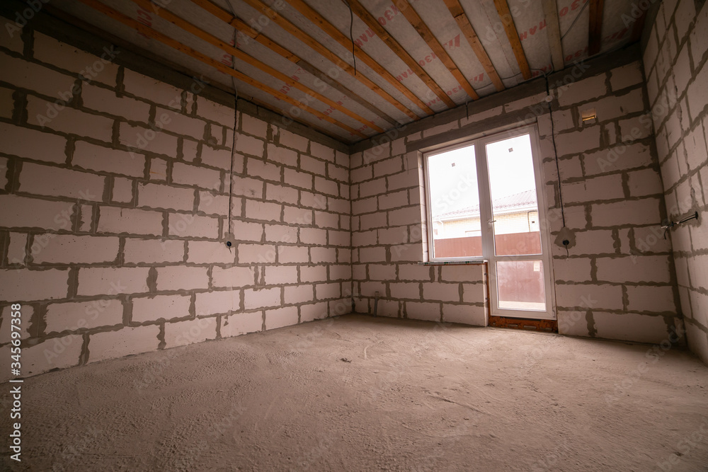 Completed apartments without repair from the builder. Final step Construction house of foam block white walls. Finished Real estate Completed apartments without repair from the builder. Final step Construction house of foam block white walls. Finished Real estate