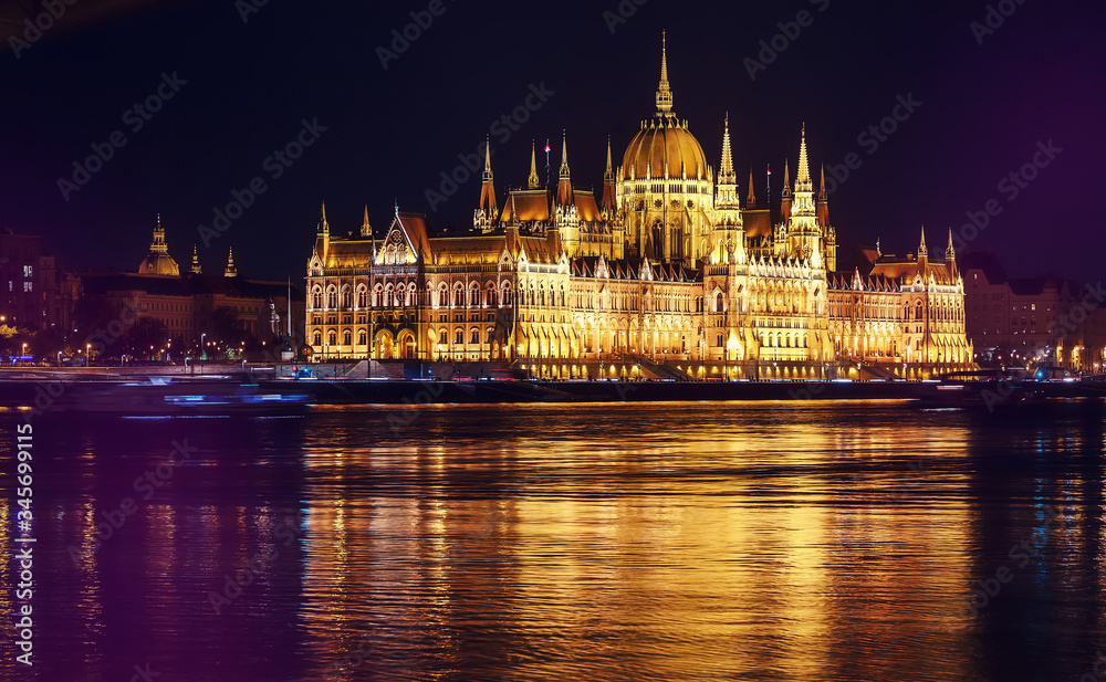 Scenic image of Hungarian parliament with reflections, Budapest with colorful dramatic sky during sunset. Fantastic view on Budapest sityscape. wonderful picturesque Scene. Popular Travel destinations