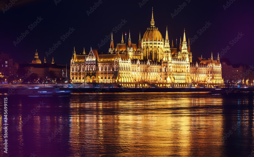 Obraz premium Scenic image of Hungarian parliament with reflections, Budapest with colorful dramatic sky during sunset. Fantastic view on Budapest sityscape. wonderful picturesque Scene. Popular Travel destinations