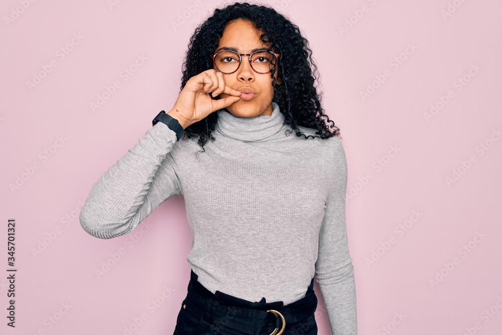 Young african american woman wearing turtleneck sweater and glasses ...