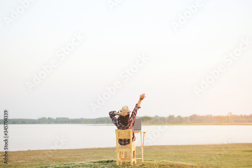 Valokuva Businesswoman working on laptop is outside in early morning, she is young and attractive girl