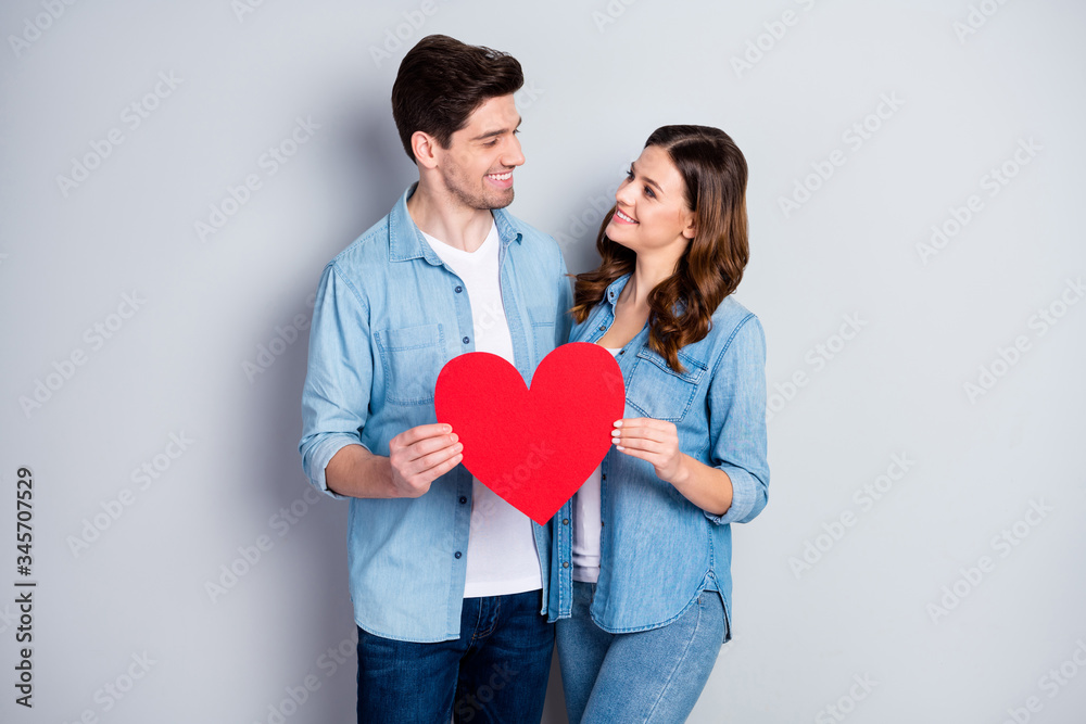 Photo two people charming lady handsome guy demonstrating per paper heart figure postcard symbolizing love wear casual denim shirts outfit isolated grey color background Photo two people charming lady handsome guy demonstrating per paper heart figure postcard symbolizing love wear casual denim shirts outfit isolated grey color background