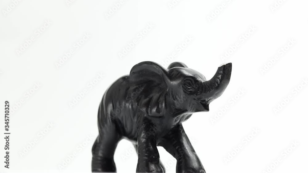 figurine of an elephant rotates on a white background figurine of an elephant rotates on a white background