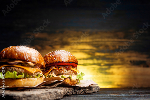 two tasty beef burger on a wooden table