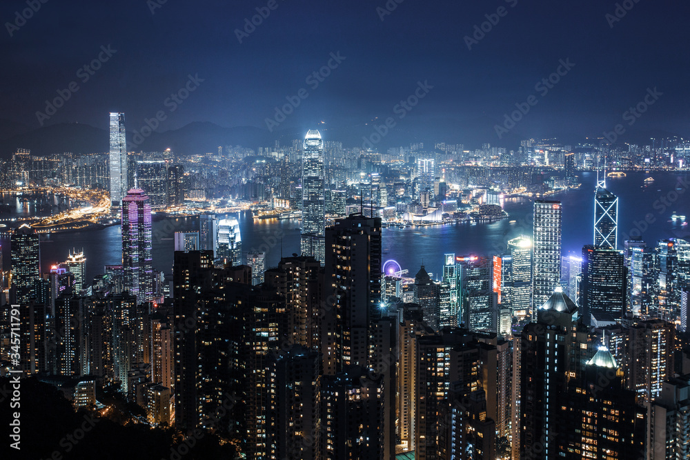 Filtered  aerial night view on Hong Kong - skyscrapers from the  the Peak .  Amazing   illuminated city