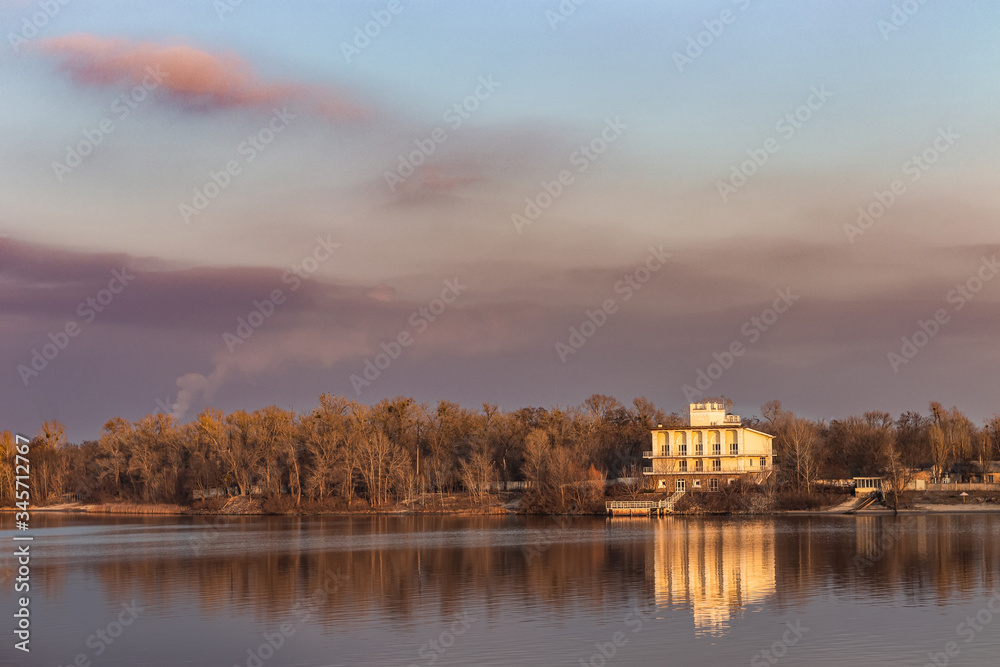 Landscape view of the opposite bank of the Dnieper River at sunset