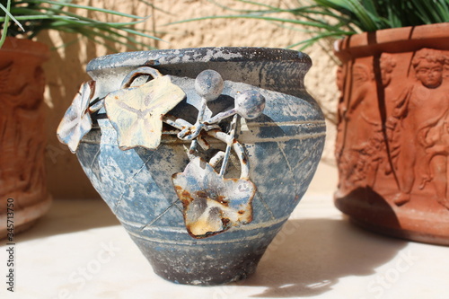 Artistic light blue clay jar  