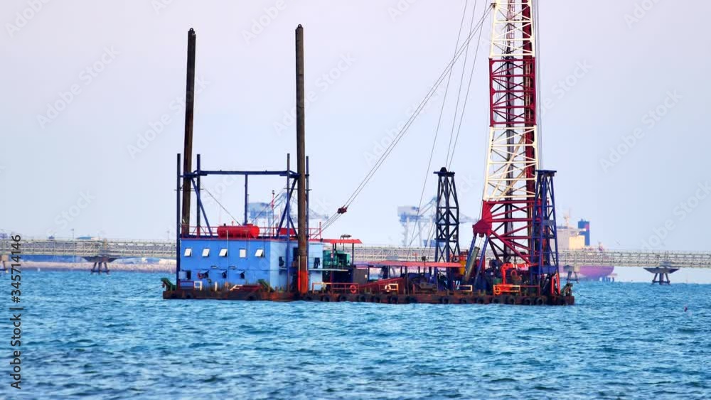 Buoy with crane Construction equipment floating in the bay Buoy with crane Construction equipment floating in the bay