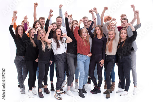 group of confident young people standing with their hands up