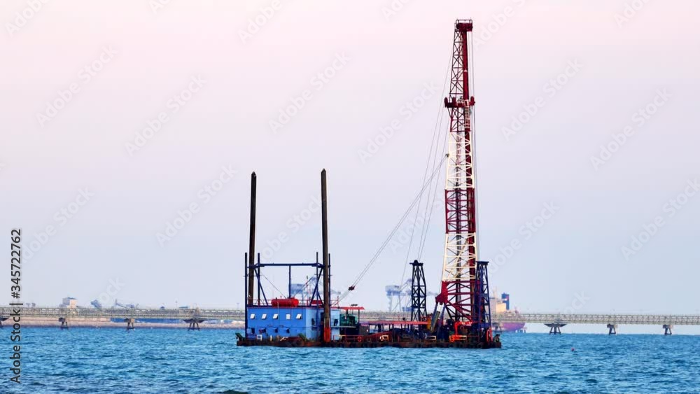 Buoy with crane Construction equipment floating in the bay Buoy with crane Construction equipment floating in the bay