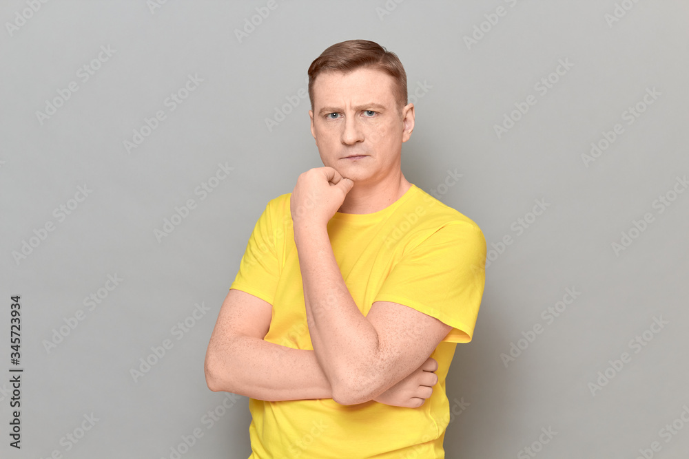 Portrait of blond mature man with serious focused expression Portrait of blond mature man with serious focused expression