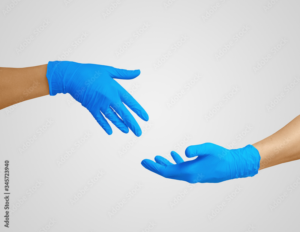 Hands in medic's nitrille blue glove. 