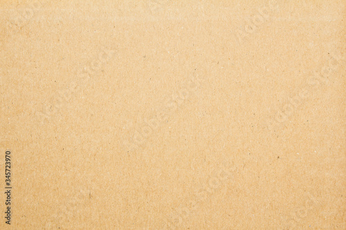 Brown rustic cardboard paper surface texture background.