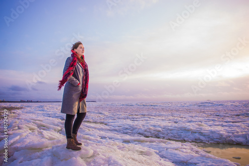girl on the background of the frozen sea