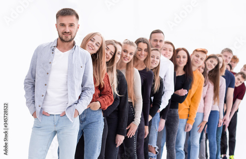 handsome guy standing in front of a group of young people