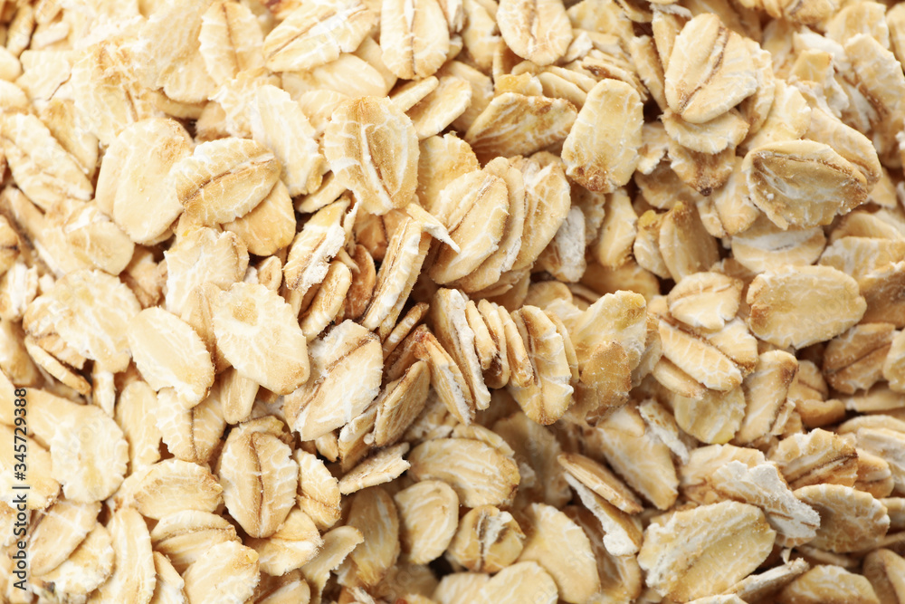 Oatmeal flakes texture on whole background, close up Oatmeal flakes texture on whole background, close up