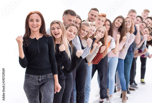 confident young woman standing in front of a column of young people