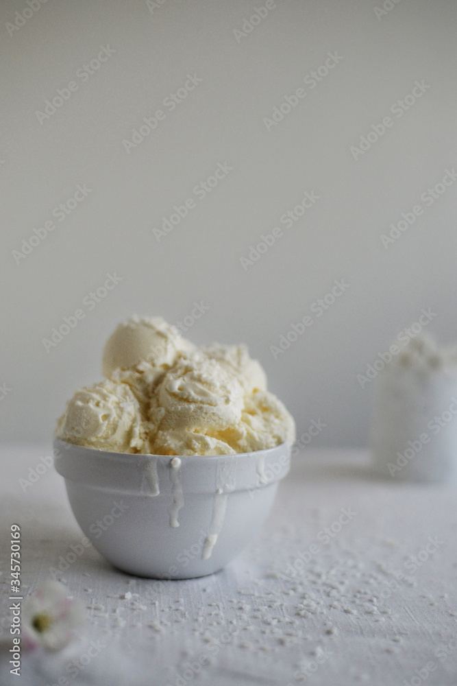White ice cream on the white table and in front of white background White ice cream on the white table and in front of white background