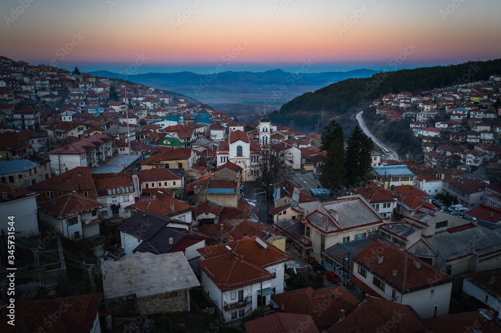 Aerial view of a city Krushevo  at sunset time in cental North Macedonia, Balkans